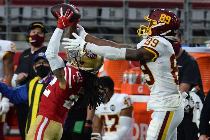 9ers cornerback Jason Verrett intercepts a pass intended for Washington Football Team wide receiver Cam Sims during the first half at State Farm Stadium.